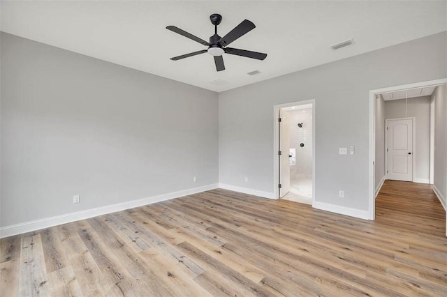 225 Water Crest Dr, Brunswick, GA 31523 - unfurnished bedroom featuring attic access, light wood finished floors, baseboards, and ensuite bathroom