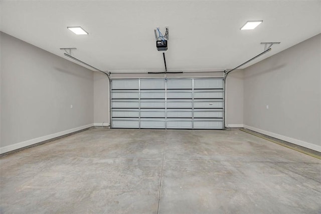 225 Water Crest Dr, Brunswick, GA 31523 - garage with baseboards and a garage door opener