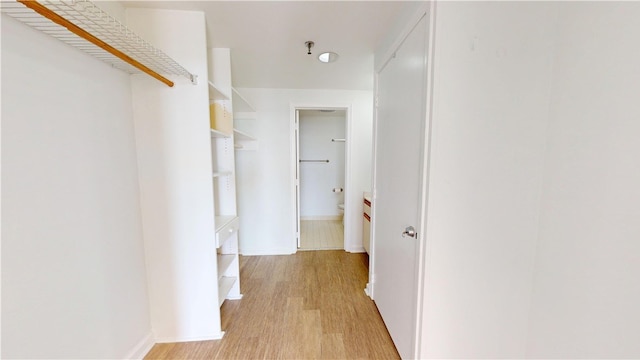 hallway featuring light wood-style flooring