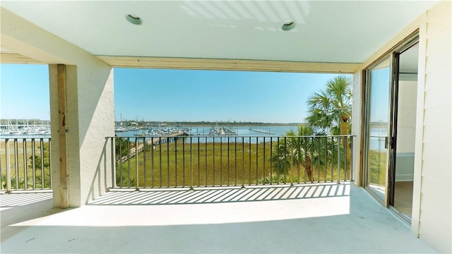 balcony featuring a water view