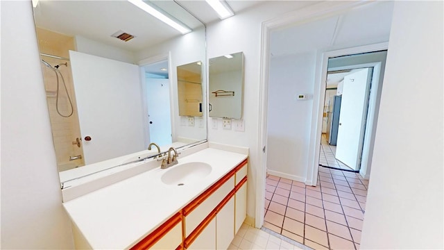 full bath featuring visible vents, vanity, and tile patterned flooring