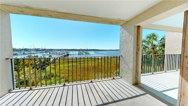 balcony featuring a water view