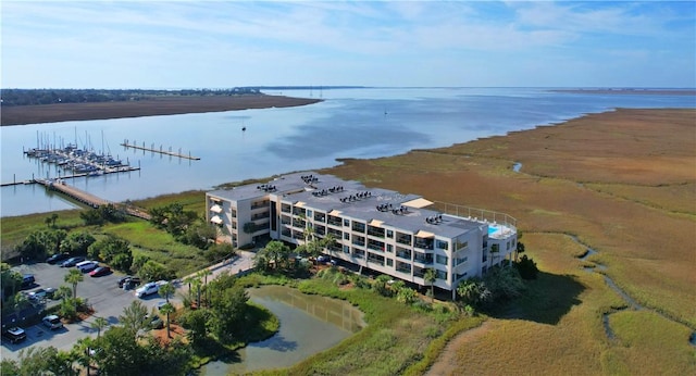 birds eye view of property with a water view