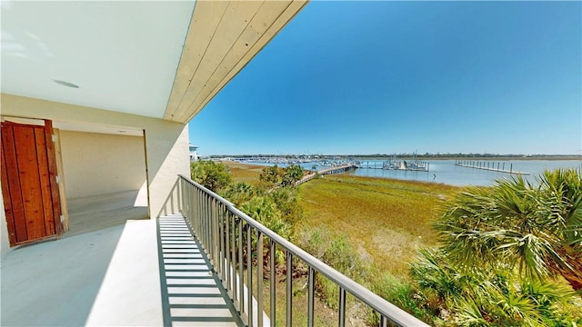 balcony featuring a water view