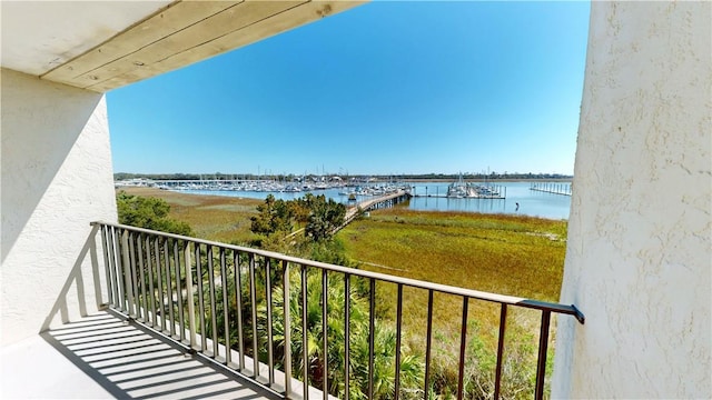 balcony featuring a water view