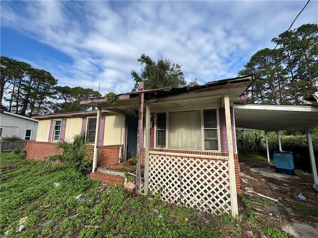 view of front of home with a carport