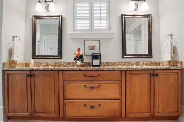 bathroom with double vanity and a sink