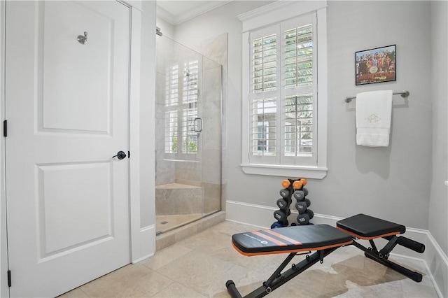 workout area with baseboards, tile patterned flooring, and ornamental molding