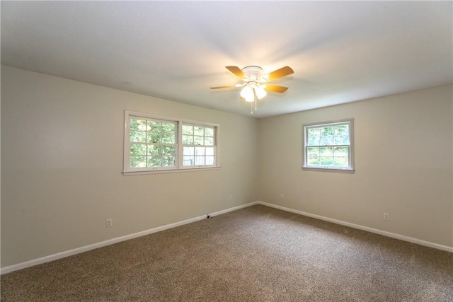 907 Euclid Ave, Waycross, GA 31501 - spare room with healthy amount of natural light, ceiling fan, and carpet