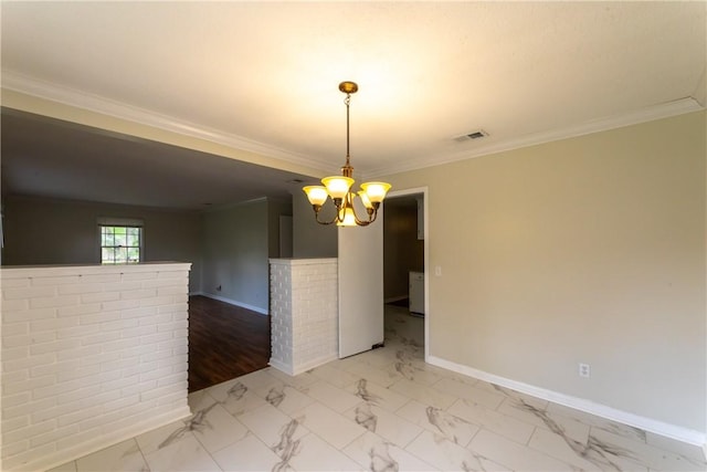 907 Euclid Ave, Waycross, GA 31501 - spare room featuring ornamental molding, a chandelier, and light marble finish flooring
