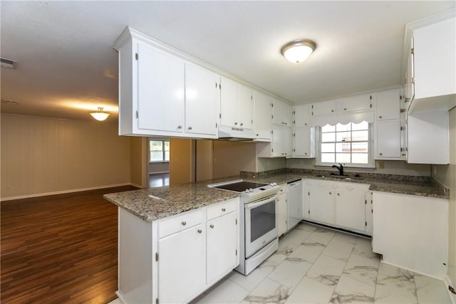 907 Euclid Ave, Waycross, GA 31501 - kitchen with white appliances, plenty of natural light, and white cabinetry