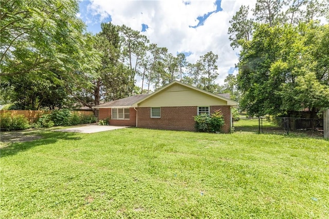 907 Euclid Ave, Waycross, GA 31501 - rear view of house featuring a patio and brick siding