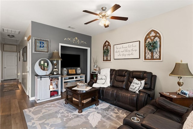 living area featuring ceiling fan and wood finished floors