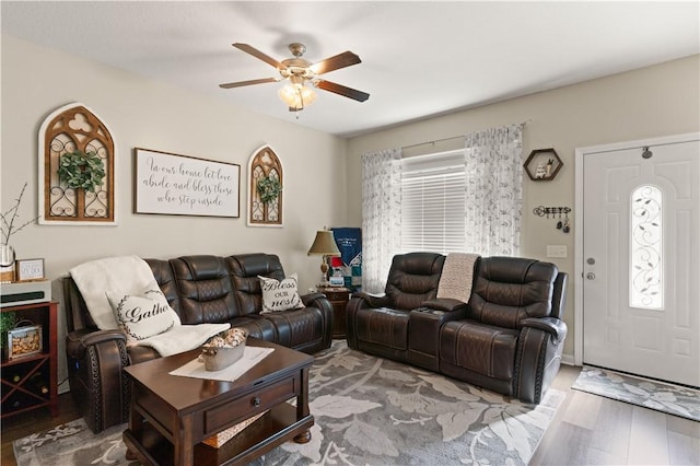 living room featuring ceiling fan and wood finished floors