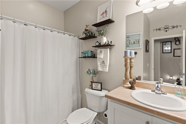 full bathroom with vanity, toilet, and a shower with shower curtain