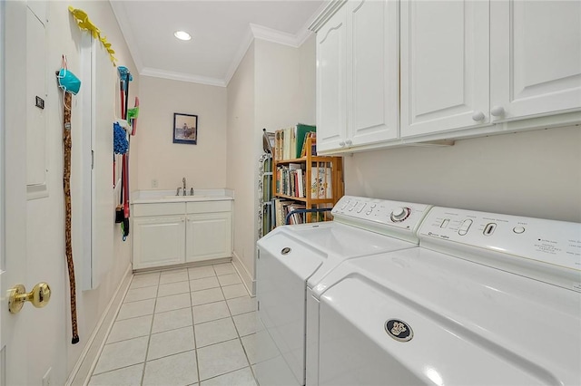 laundry room featuring sink, cabinets, separate washer and dryer, light tile patterned floors, and ornamental molding