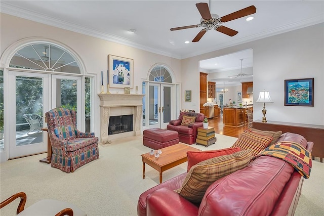 living room featuring french doors, ceiling fan, and crown molding