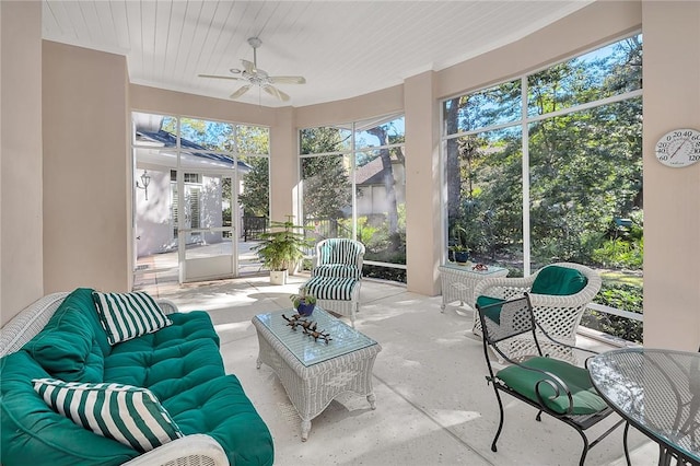 sunroom featuring ceiling fan