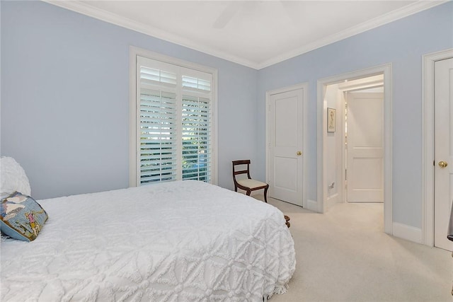 bedroom with ceiling fan, crown molding, and light colored carpet