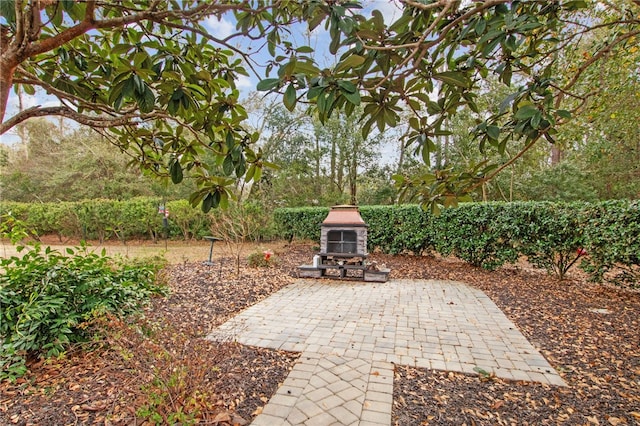 view of patio / terrace with an outdoor stone fireplace