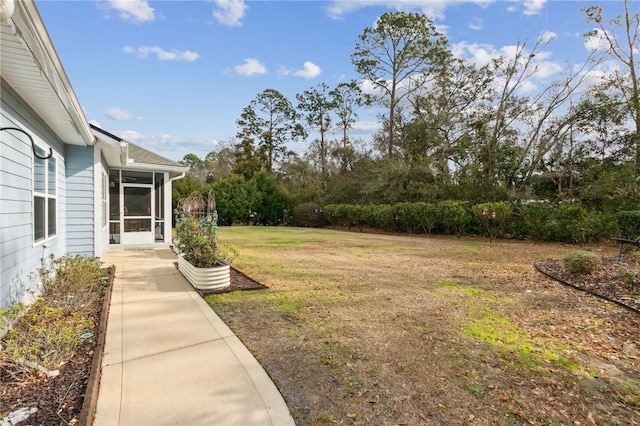 view of yard with a sunroom