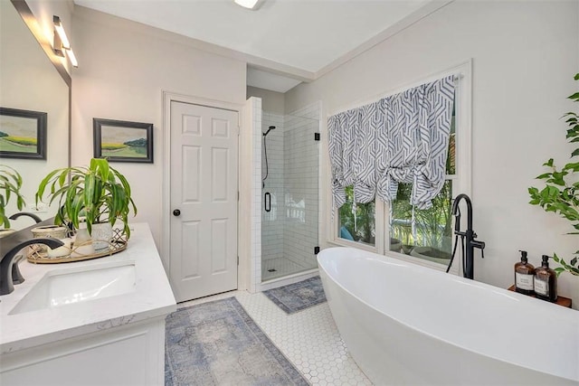 107 Newfield St, Saint Simons Island, GA 31522 - bathroom featuring a shower stall, a freestanding tub, double vanity, and tile patterned floors