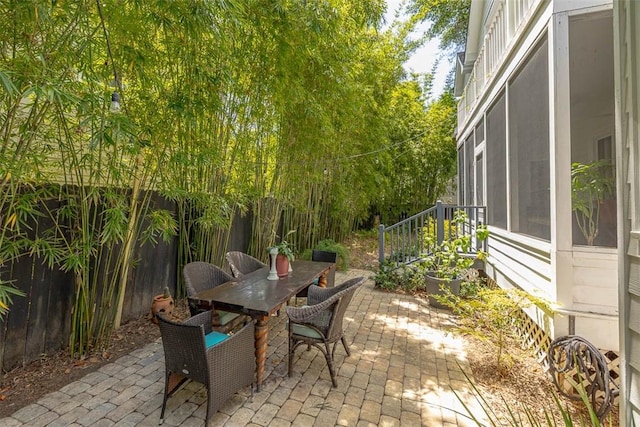 107 Newfield St, Saint Simons Island, GA 31522 - view of patio / terrace featuring outdoor dining space and fence