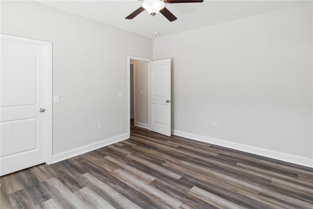 unfurnished bedroom featuring dark hardwood / wood-style flooring and ceiling fan