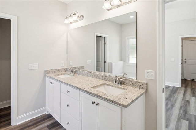 bathroom featuring hardwood / wood-style floors and vanity