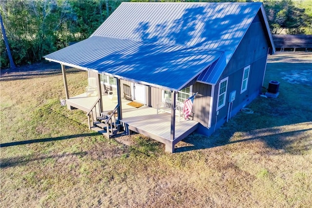 exterior space featuring a yard and central air condition unit