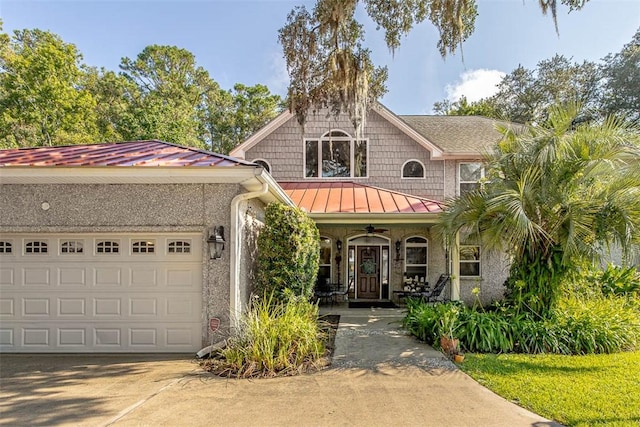 view of front of house featuring covered porch and a garage