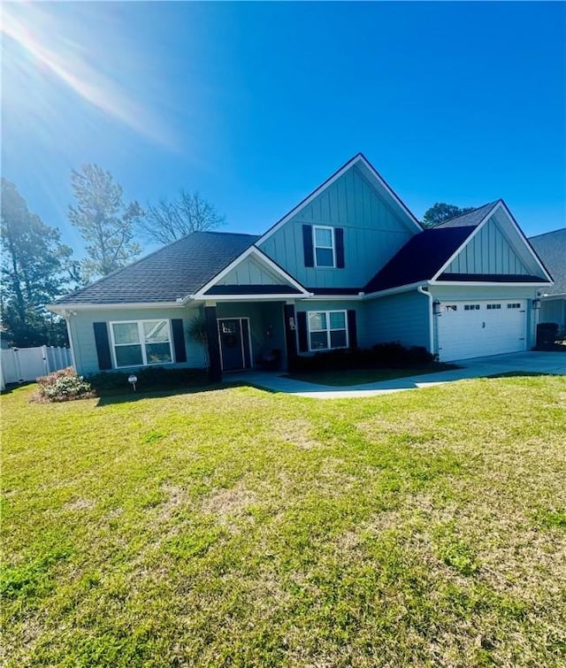 view of front of house featuring a front lawn, fence, board and batten siding, concrete driveway, and an attached garage