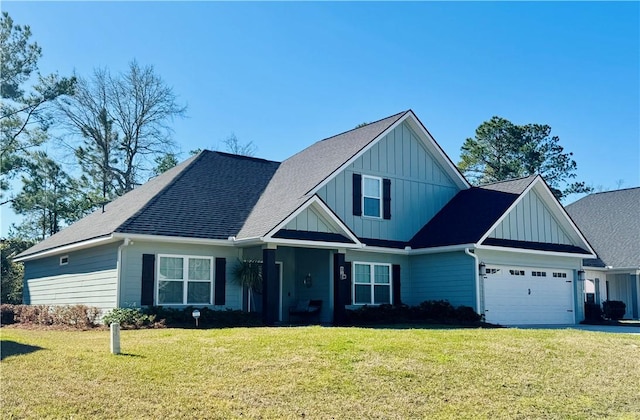 craftsman inspired home featuring driveway, a front yard, a garage, and board and batten siding