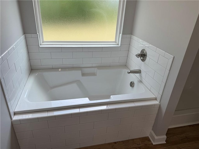 100 Haven Ct, Brunswick, GA 31523 - full bath with plenty of natural light, a bath, and wood finished floors