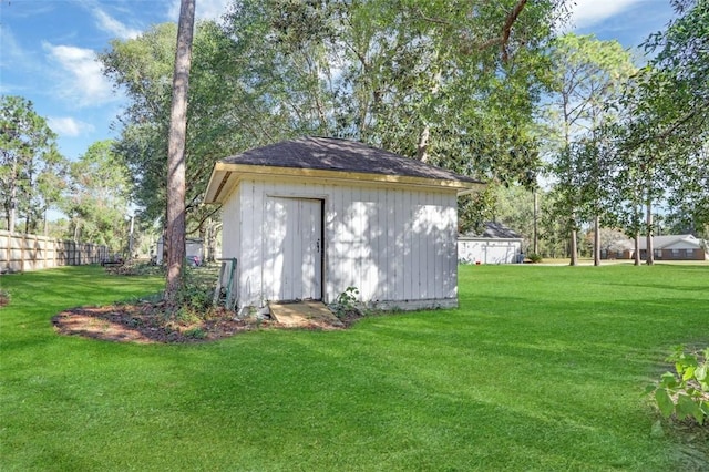 view of outbuilding with a lawn