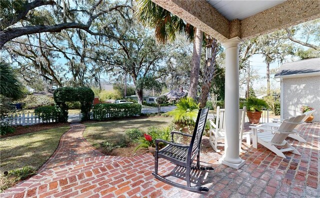 231 Magnolia Ave, Saint Simons Island, GA 31522 - view of patio featuring fence