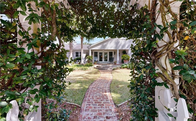 231 Magnolia Ave, Saint Simons Island, GA 31522 - view of yard with french doors