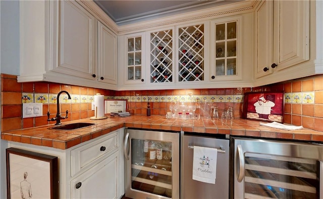 231 Magnolia Ave, Saint Simons Island, GA 31522 - indoor wet bar featuring beverage cooler and backsplash