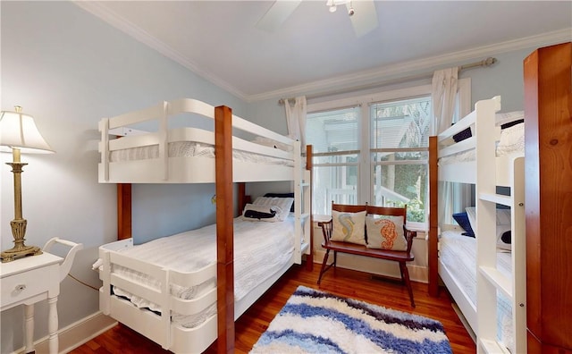 231 Magnolia Ave, Saint Simons Island, GA 31522 - bedroom with crown molding, wood finished floors, baseboards, and a ceiling fan