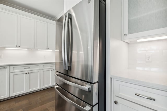 104 Tidal Marsh Way, Saint Marys, GA 31558 - kitchen featuring freestanding refrigerator, white cabinets, dark wood-style flooring, tasteful backsplash, and light countertops