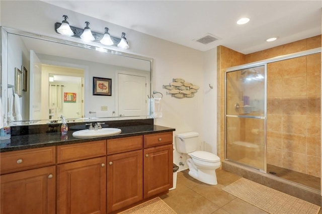 760 Ocean Blvd Unit 402, Saint Simons Island, GA 31522 - full bath with toilet, vanity, a stall shower, and tile patterned flooring