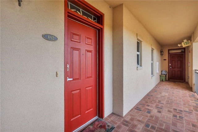 760 Ocean Blvd Unit 402, Saint Simons Island, GA 31522 - doorway to property with stucco siding