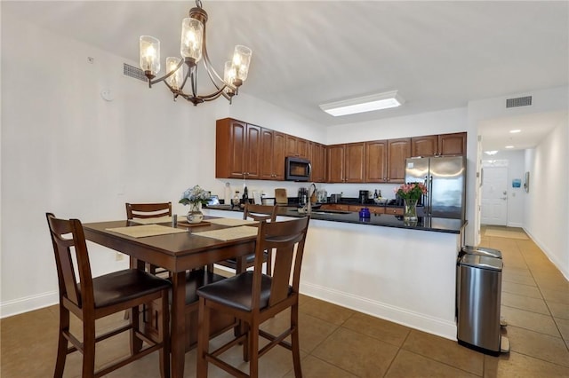 760 Ocean Blvd Unit 402, Saint Simons Island, GA 31522 - tiled dining space with a chandelier and baseboards