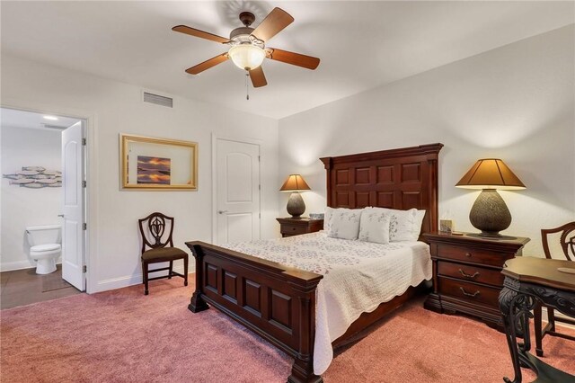 760 Ocean Blvd Unit 402, Saint Simons Island, GA 31522 - carpeted bedroom with baseboards, connected bathroom, and ceiling fan