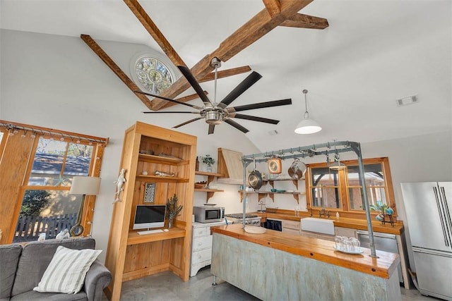 kitchen with stainless steel appliances, ceiling fan, sink, high vaulted ceiling, and butcher block countertops