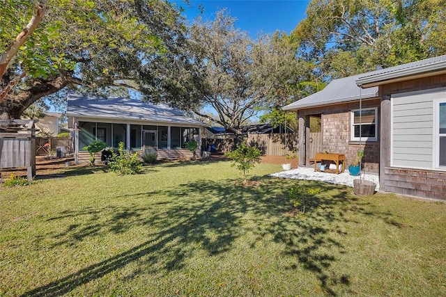 view of yard with a sunroom