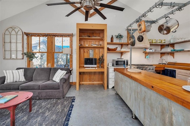 living room with ceiling fan and vaulted ceiling