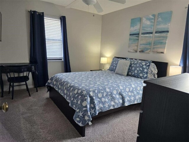 bedroom with ceiling fan and carpet floors