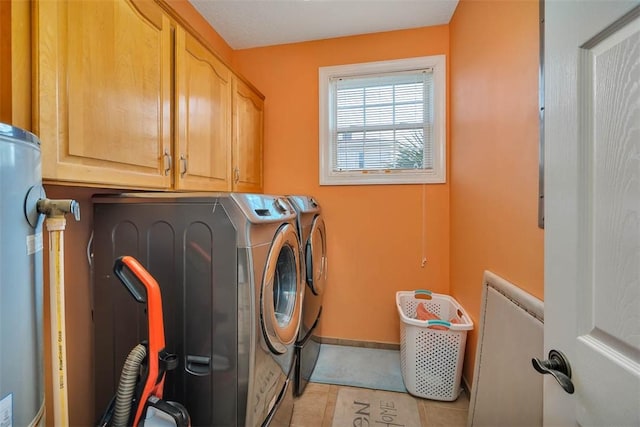 4153 River Side Dr, Brunswick, GA 31520 - washroom featuring separate washer and dryer, cabinet space, and light tile patterned floors