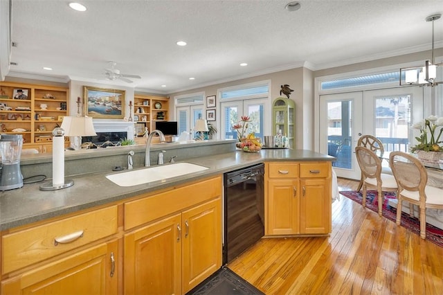 4153 River Side Dr, Brunswick, GA 31520 - kitchen with black dishwasher, light wood-style floors, french doors, ornamental molding, and a ceiling fan